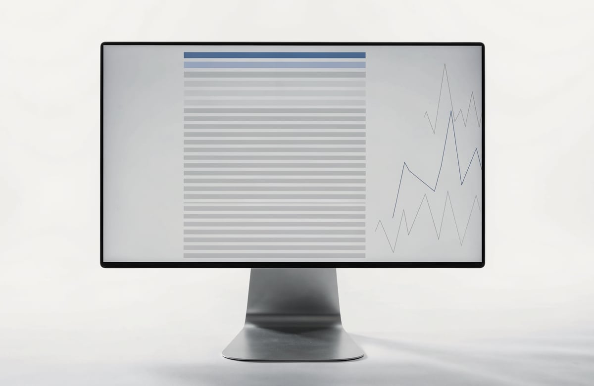 Product photograph: a monitor displaying the scanner — a dense ranked list of equities with the reference company highlighted at the top, its closest statistical peers directly beneath it, and comparison traces alongside.